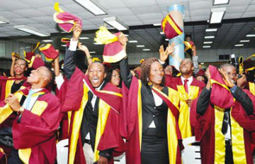 Unilag postgraduate students in convocation ceremonial gowns